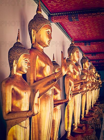 Vintage retro effect filtered hipster style image of sitting Buddha statues in Buddhist temple Wat Pho