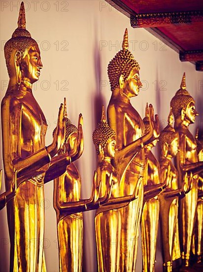 Vintage retro effect filtered hipster style image of sitting Buddha statues in Buddhist temple Wat Pho