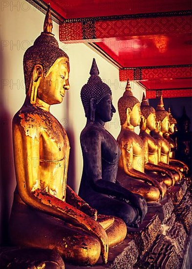 Vintage retro effect filtered hipster style image of sitting Buddha statues in Buddhist temple Wat Pho