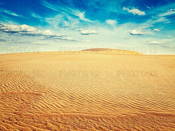 Vintage retro effect filtered hipster style image of white sand dunes on sunrise