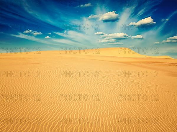 Vintage retro effect filtered hipster style image of white sand dunes on sunrise