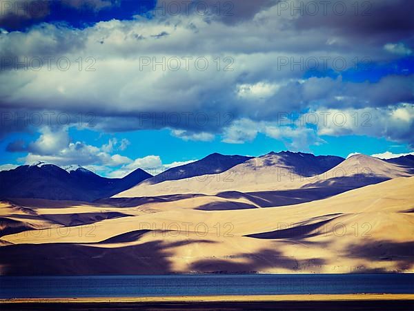 Vintage retro effect filtered hipster style image of Himalayan mountain lake in Himalayas Tso Moriri