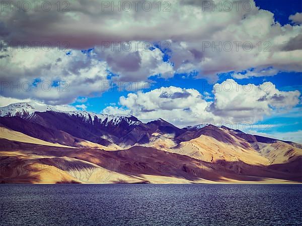 Vintage retro effect filtered hipster style image of Himalayan mountain lake in Himalayas Tso Moriri on sunset