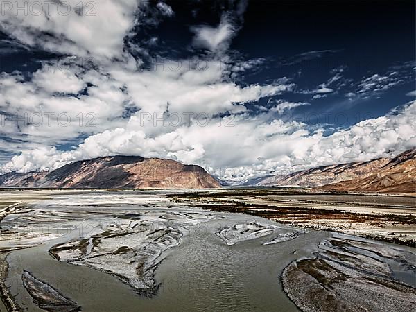 Vintage retro effect filtered hipster style image of Nubra valley and Nubra river in Himalayas. Ladakh