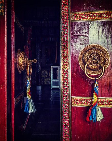 Vintage retro effect filtered hipster style image of open door of Spituk Gompa