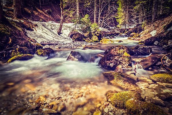 Vintage retro hipster style travel image of Cascade of Sibli-Wasserfall. Rottach-Egern