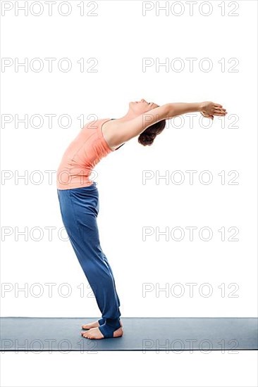 Beautiful sporty fit woman practices Sivananmda yoga asana Anuvittasana