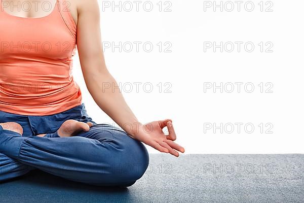 Close up of woman doing yoga asana Padmasana