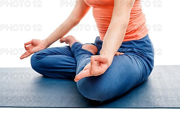 Close up of woman doing yoga asana Padmasana