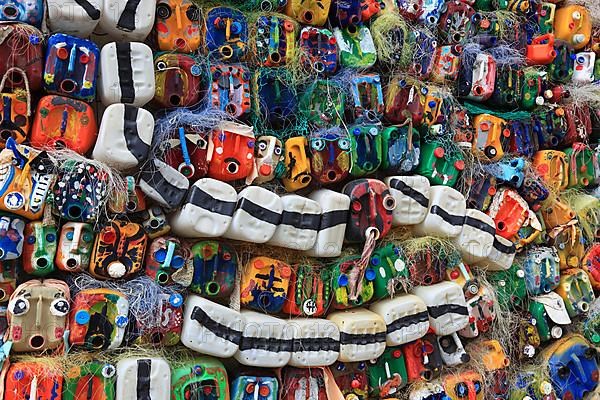 Wall with colourful canisters