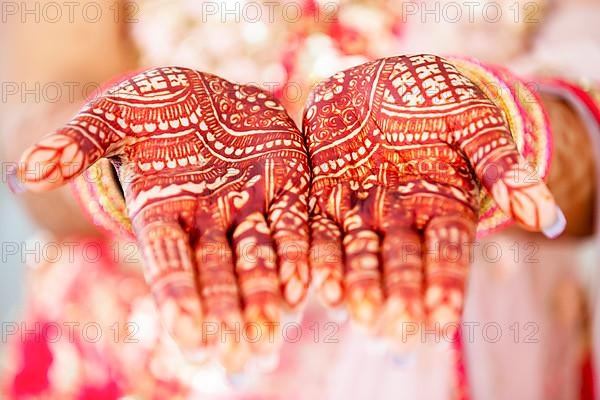 Beautiful henna design on hand of Hindu bride