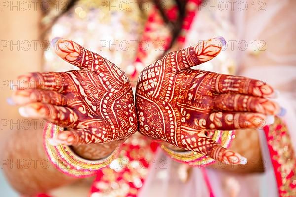 Beautiful henna design on hand of Hindu bride