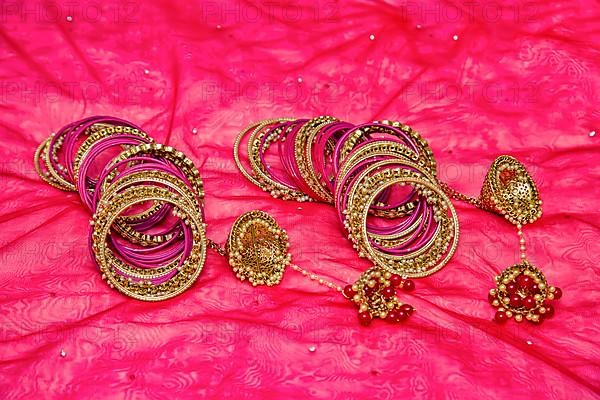 Closeup of Hindu brides bangles on red