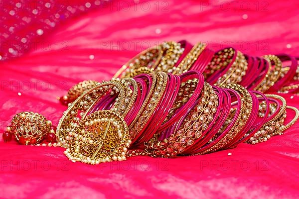 Closeup of Hindu brides bangles on red