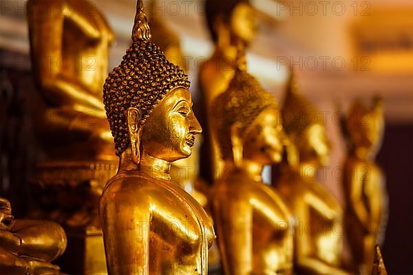 Golden Buddha statues in buddhist temple Wat Saket