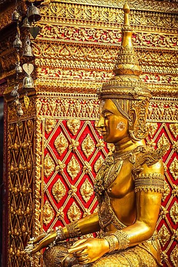 Gold sitting Buddha statue in Wat Phra That Doi Suthep