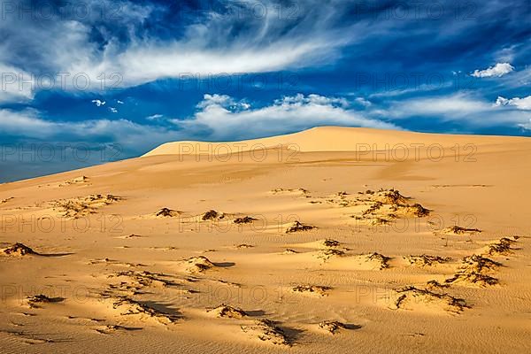 White sand dunes in desert on sunrise