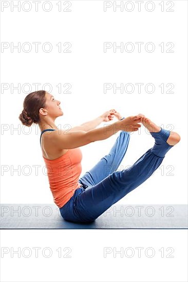 Beautiful sporty fit woman doing Ashtanga Vinyasa yoga asana Upavistha konasana B