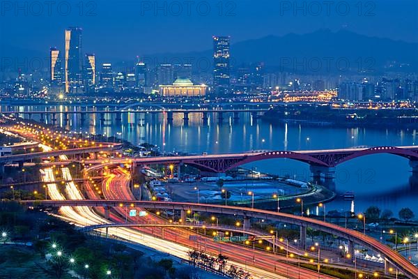 Aerial view of Seoul downtown cityscape and Seongsan bridge over Han River in twilight. Seoul