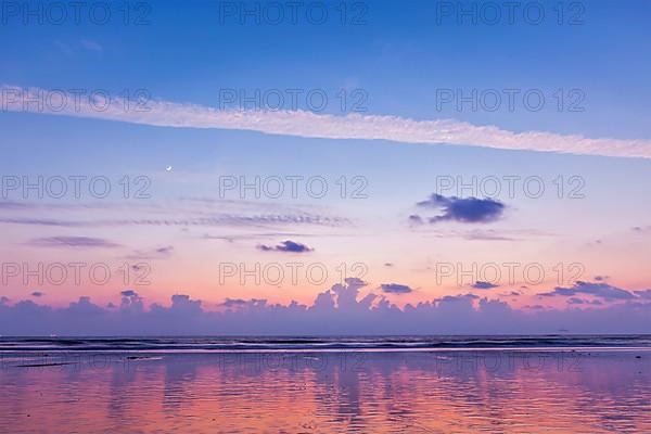 Sunset on Baga beach Indian ocean. Goa