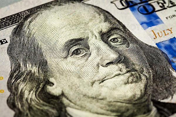 Macro shot of Benjamin Franklin portrait from a 100 bill new 2013 year edition