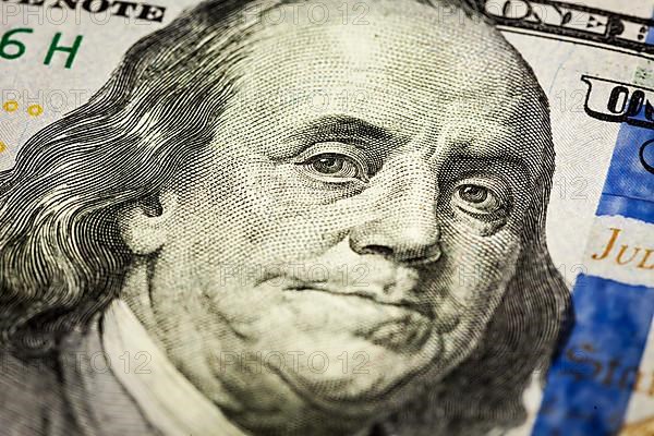 Macro shot of Benjamin Franklin portrait from a 100 bill new 2013 year edition