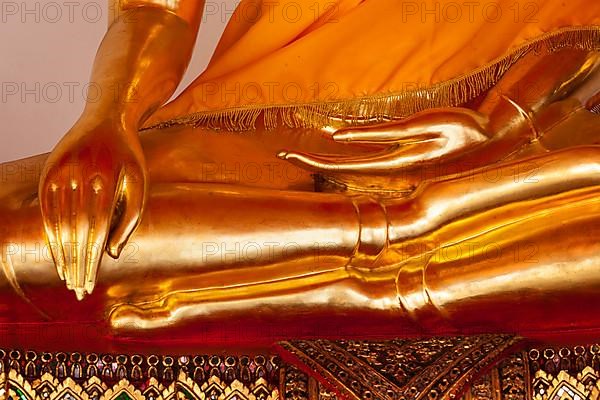 Sitting golden Buddha statue close up details. Wat Pho temple