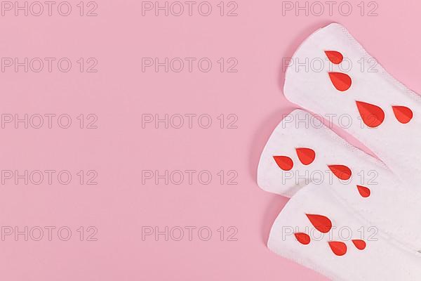 Female period concept with panty liner with symbolic paper blood
