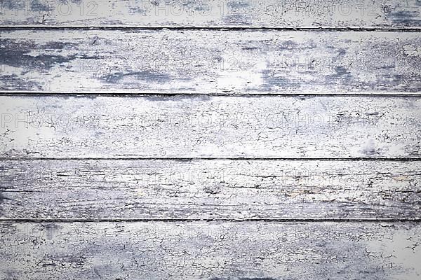 Wooden background with gray colored horizontal planks and chipped paint