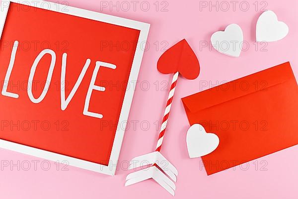 Valentines Day composition with picture frame with text LOVE