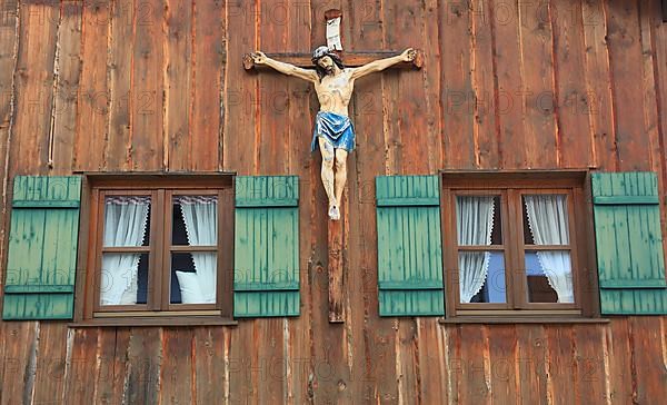 Crucifix on a wooden wall