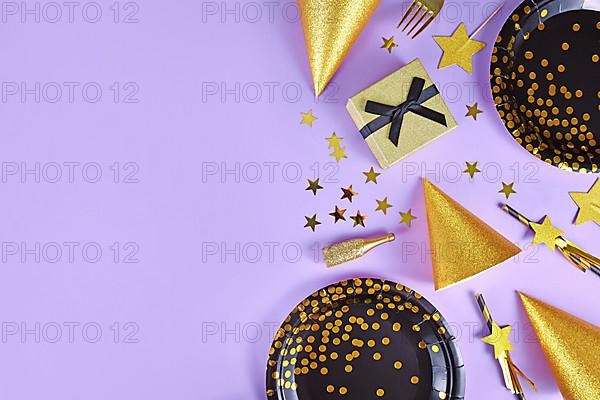 Party flat lay with black and golden plates