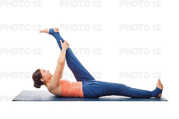 Woman doing Yoga asana Supta padangusthasana