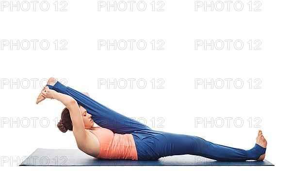 Woman doing Yoga asana Supta padangusthasana