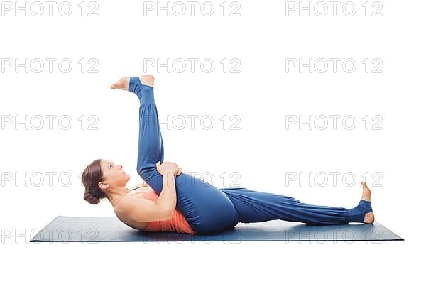Woman doing Yoga asana Supta padangusthasana