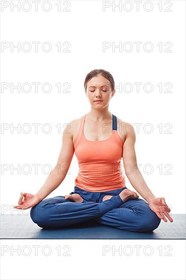 Woman meditating in yoga asana Padmasana