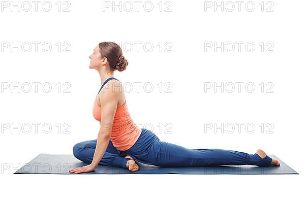 Woman doing yoga asana Eka pada kapotasana