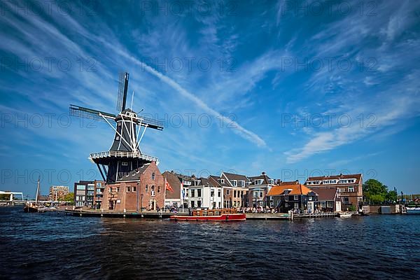 View of Harlem landmark windmill De Adriaan on Spaarne river. Harlem