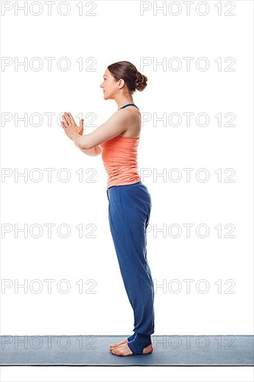 Woman doing yoga asana Tadasana namaste