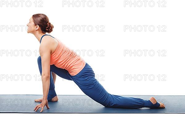 Woman doing yoga asana Anjaneyasana