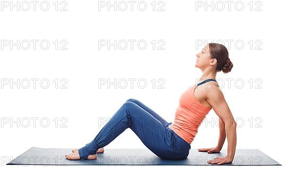 Woman preparing for yoga asana Upward Plank Pose