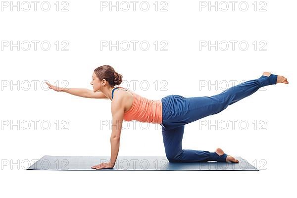 Woman doing Hatha yoga asana isolated on white background