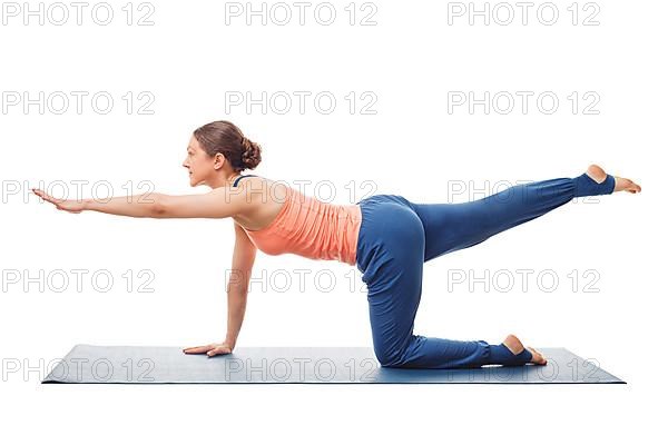Woman doing Hatha yoga asana isolated on white background