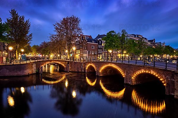 Night view of Amterdam cityscape with canal