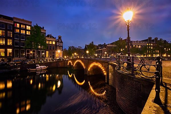 Night view of Amterdam cityscape with canal