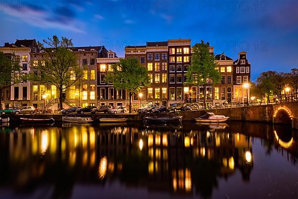 Night view of Amterdam cityscape with canal