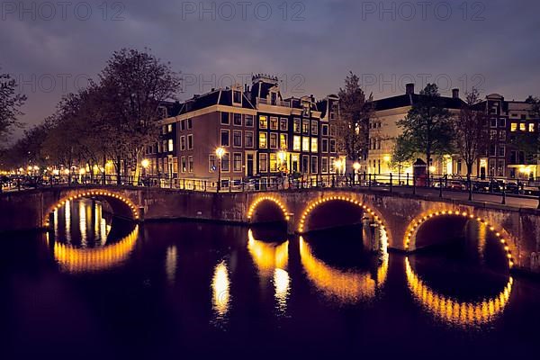 Night view of Amterdam cityscape with canal