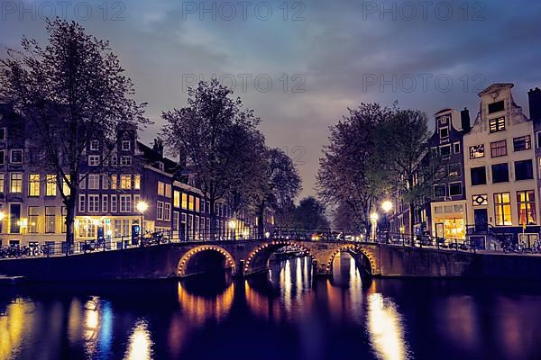 Night view of Amterdam cityscape with canal