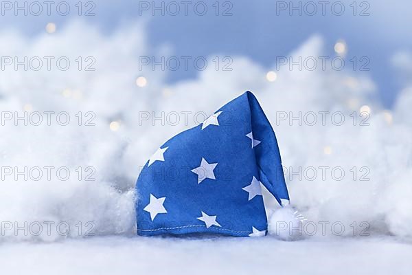 Blue nightcap with stars surrounded by clouds and stars