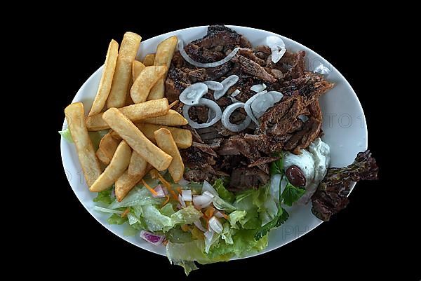 Giros with fries and salad with tzatziki on a black background